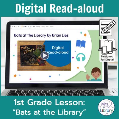 Laptop computer screen showing "Bats at the Library" Digital Read-aloud title slide with 2 banners reading Digital Read-aloud and 1st Grade Lesson "Bats at the Library"